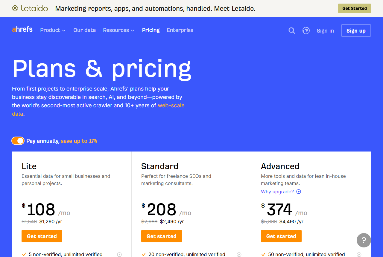 Ahrefs Plans and pricing page with the Pay annually switch turned on: Lite at $108 a month with $1,548 struck through and $1,290 a year, Standard at $208 with $2,988 struck through and $2,490 a year, and Advanced at $374 with $5,388 struck through and $4,490 a year