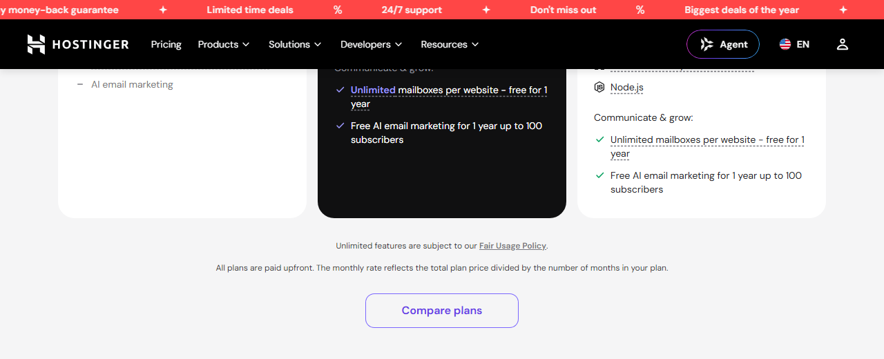 Small print under the Hostinger plan cards: Unlimited features are subject to our Fair Usage Policy, and All plans are paid upfront, the monthly rate reflects the total plan price divided by the number of months in your plan, above a Compare plans button