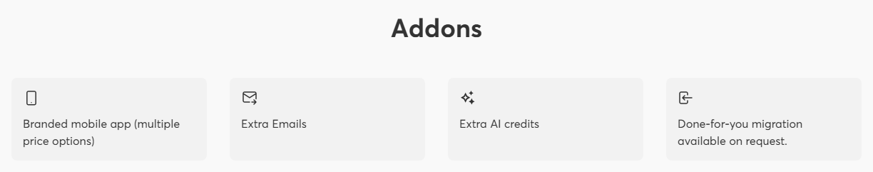 LearnWorlds pricing page Addons section with four tiles and no prices: Branded mobile app with multiple price options, Extra Emails, Extra AI credits, and Done-for-you migration available on request